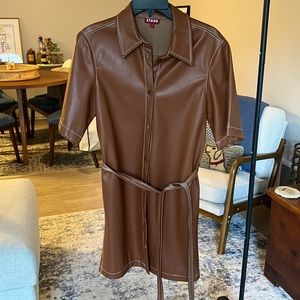 Staud faux leather dress with white stitching.